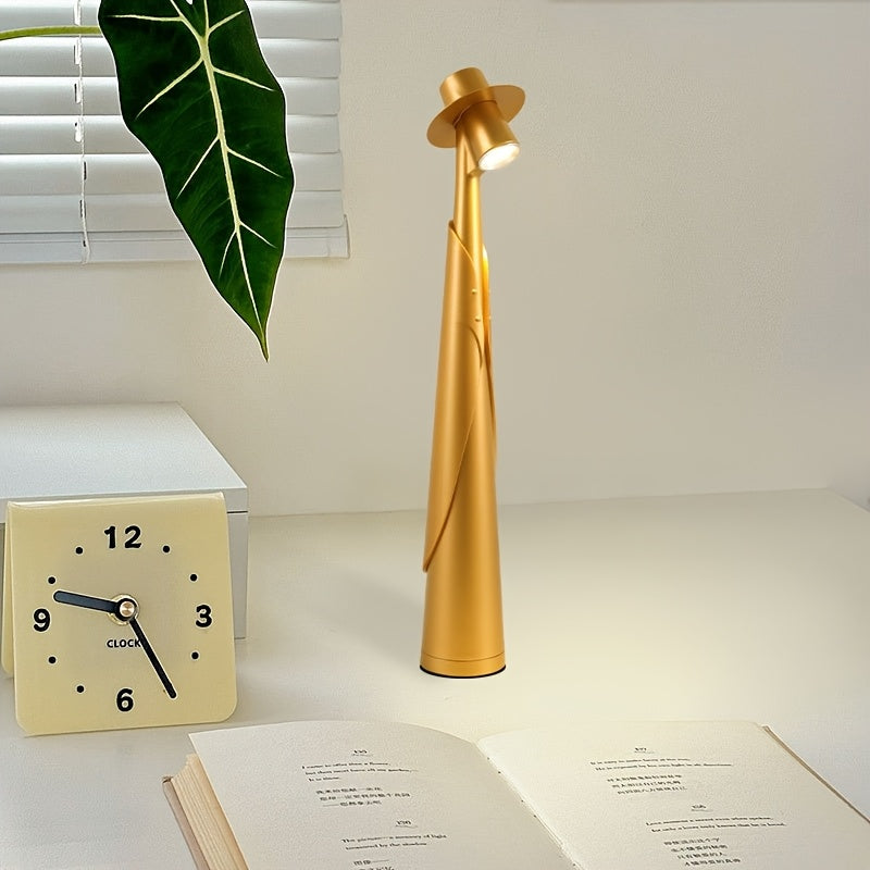 Lámpara de mesa escultórica con silueta de sombrero, recargable y con control táctil