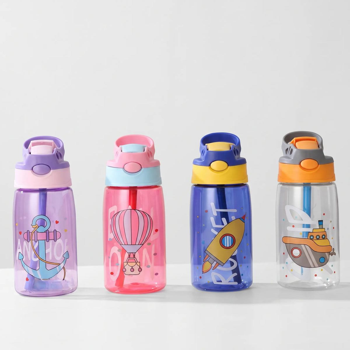 Botella de agua infantil transparente con estampado de dibujos animados, botón pulsador y pajita