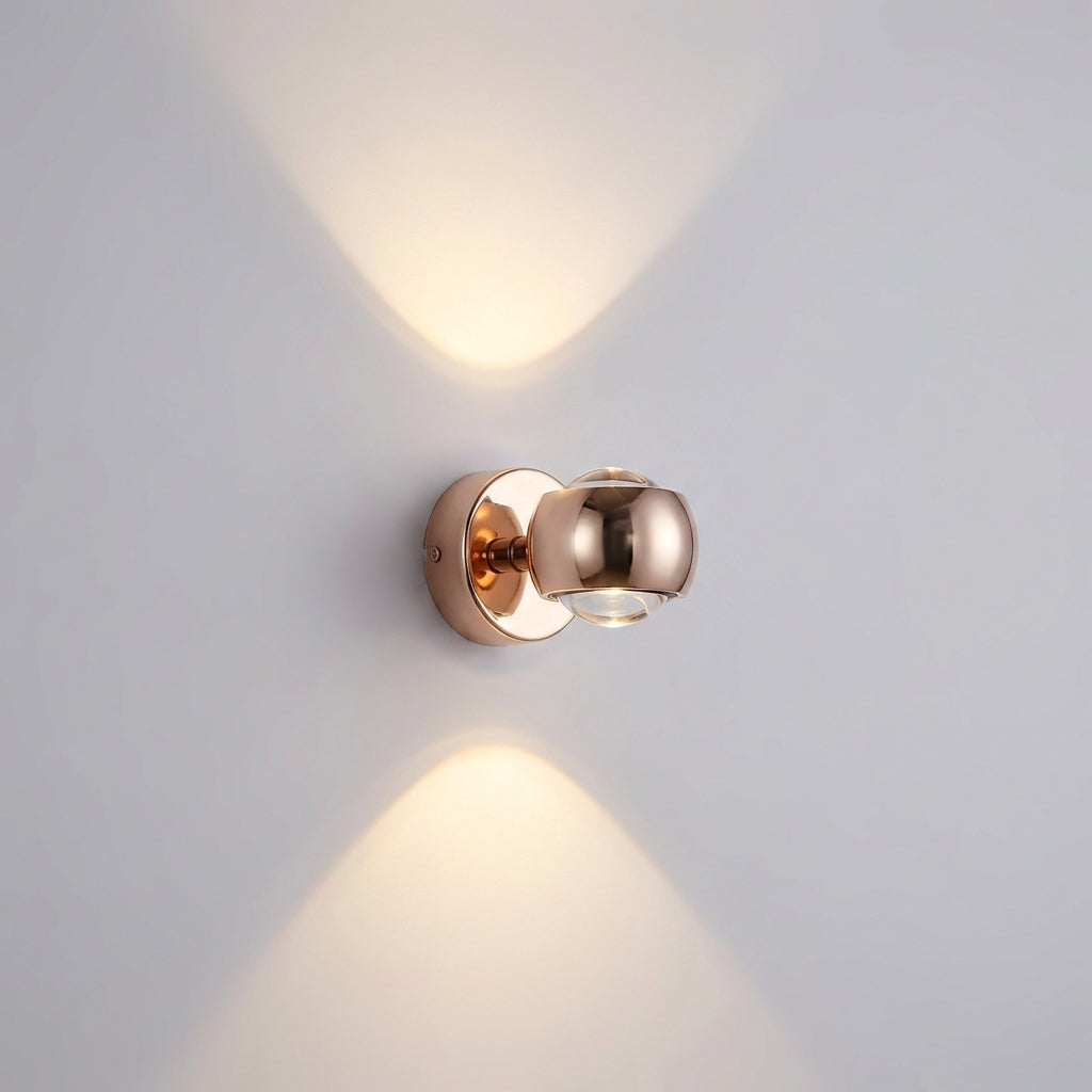 Lámpara de pared escultórica compacta de metal con dos cristales giratorios