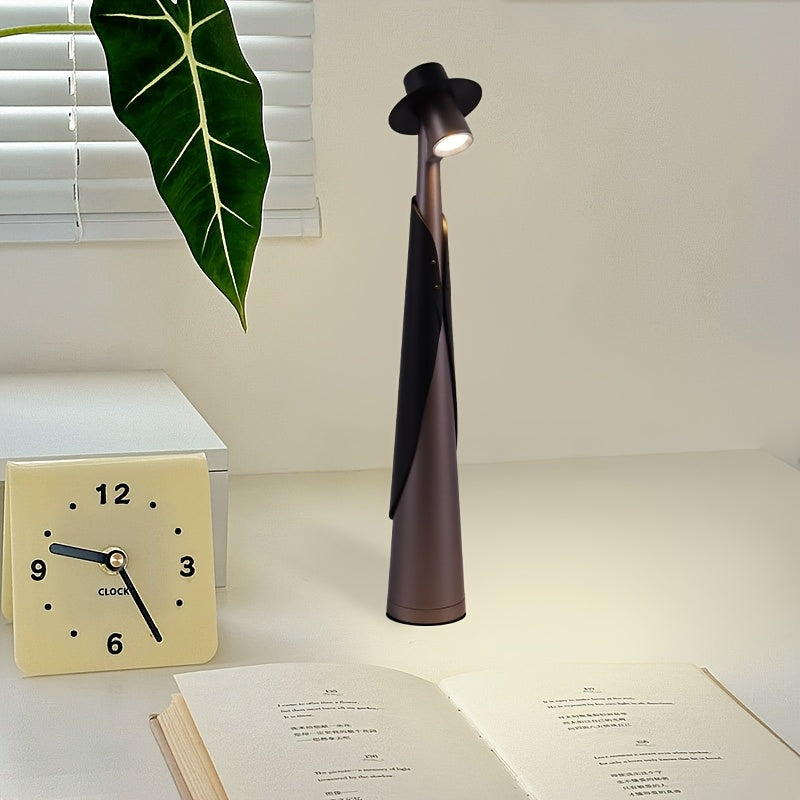 Lámpara de mesa escultórica con silueta de sombrero, recargable y con control táctil