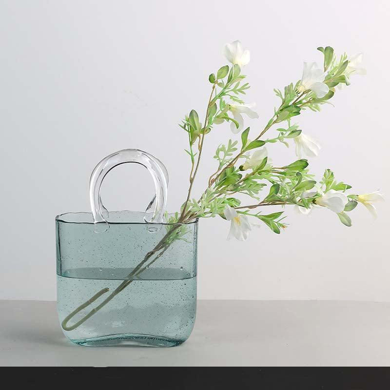 Jarrón decorativo de flores de vidrio transparente con silueta escultórica de bolso