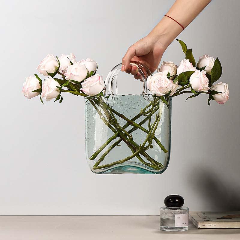 Jarrón decorativo de flores de vidrio transparente con silueta escultórica de bolso