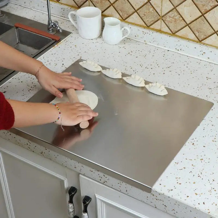 Tabla de cortar de acero inoxidable antideslizante con borde elevado