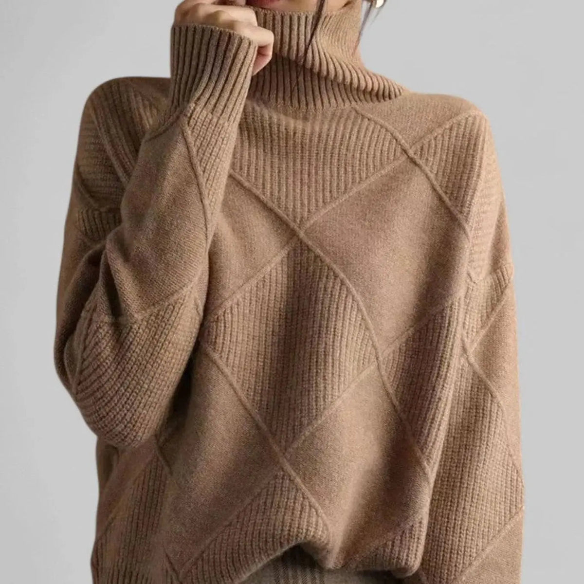 Suéter extragrande de punto de rombos con cuello alto para mujer