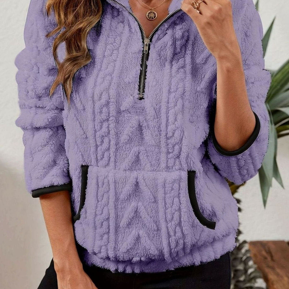 Jersey polar texturizado de manga larga con media cremallera y bolsillo tipo canguro para mujer