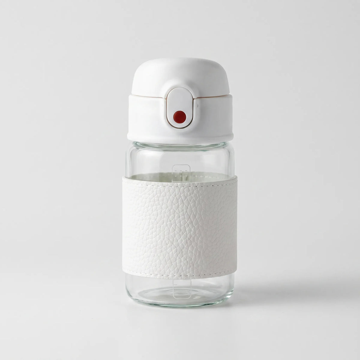 Botella de agua de vidrio con agarre texturizado, botón pulsador y pajita