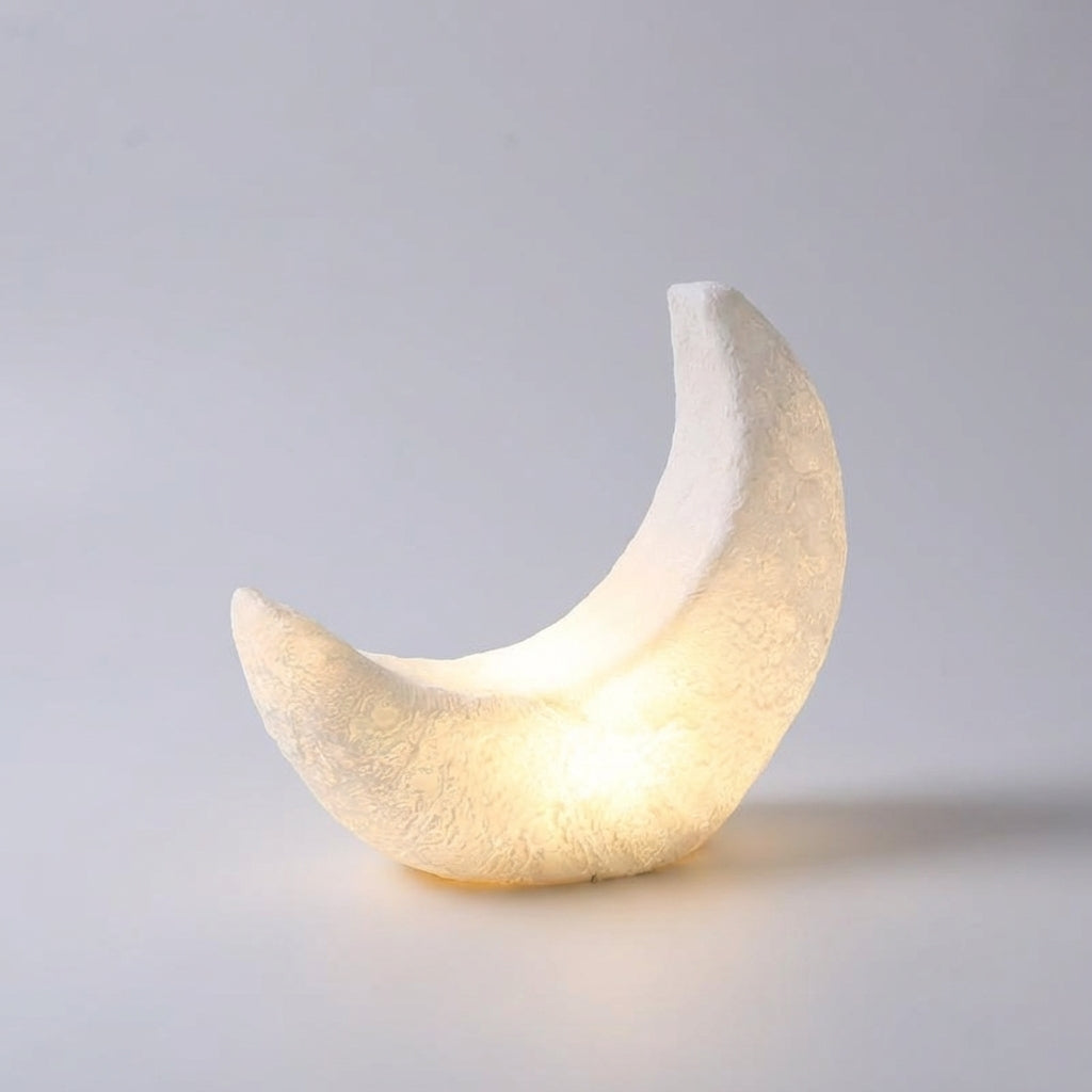 Lámpara de mesa art déco con silueta de media luna, pantalla mate y sin cable