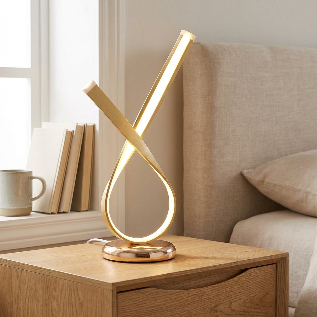Lámpara de mesa compacta con silueta de bucle escultural y difusor
