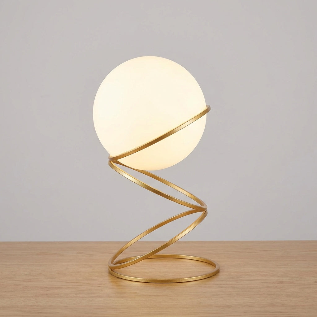 Lámpara de mesa escultural con base metálica en espiral y esfera de acrílico redonda