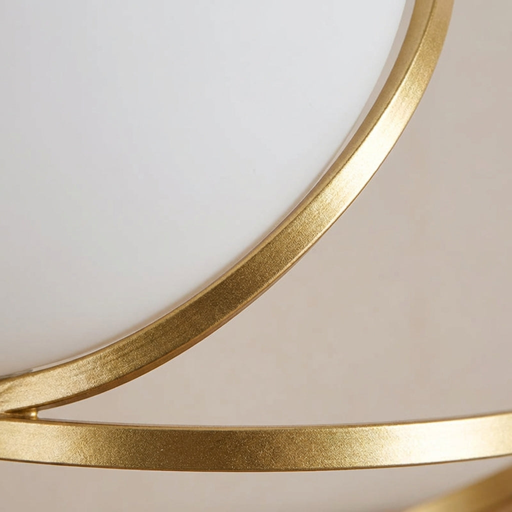 Lámpara de mesa escultural con base metálica en espiral y esfera de acrílico redonda