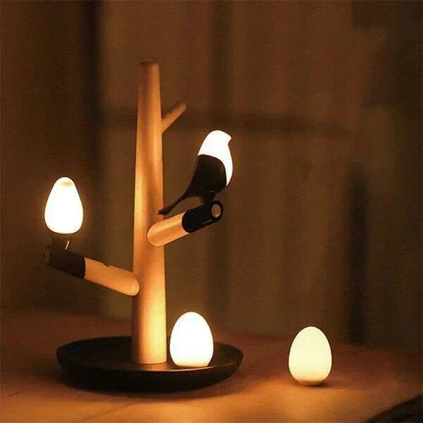 Lámpara de mesa con sensor de movimiento, silueta de pájaro en una rama y control por toque