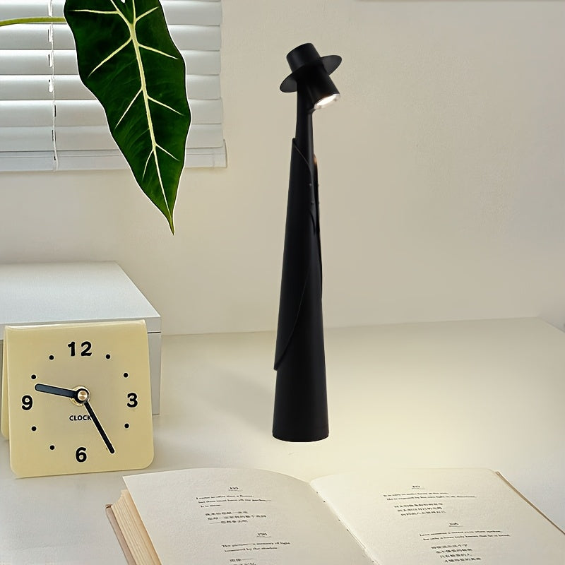 Lámpara de mesa escultórica con silueta de sombrero, recargable y con control táctil
