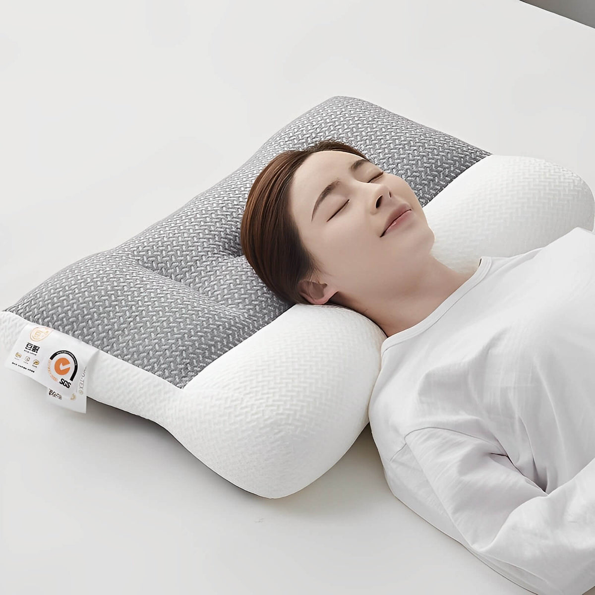 Almohada ortopédica contorneada de espuma viscoelástica transpirable e hipoalergénica para soporte cervical