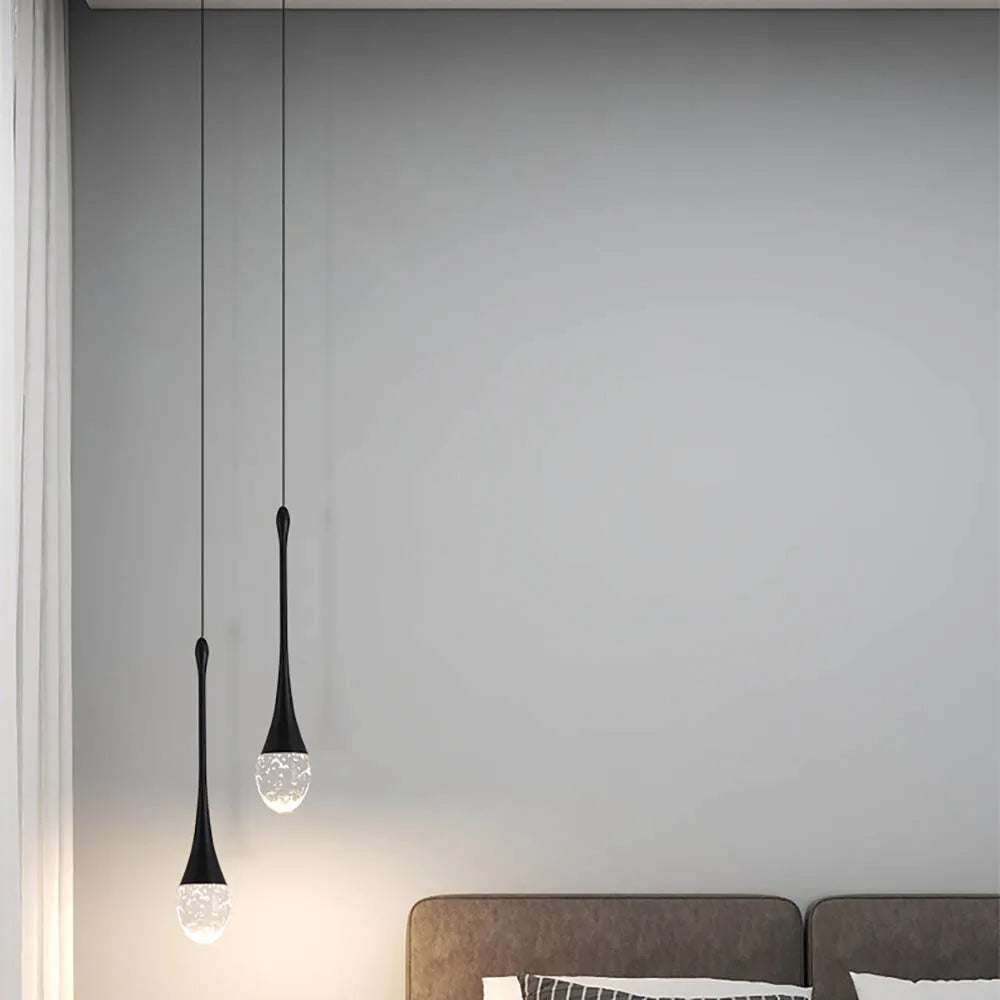 Lámpara colgante minimalista de vidrio con forma de gota y altura ajustable