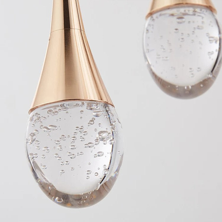 Lámpara colgante minimalista de vidrio con forma de gota y altura ajustable