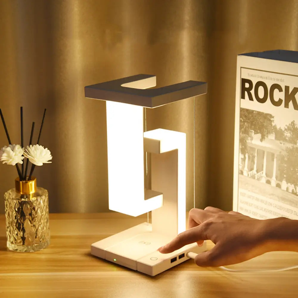 Lámpara de mesa con iluminación de zona flotante y carga inalámbrica