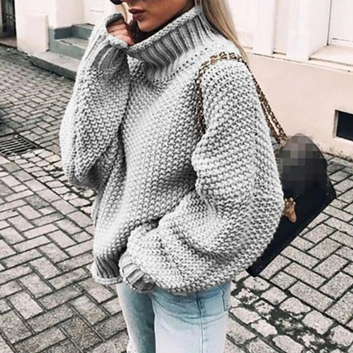 Jersey oversize de punto grueso para mujer con cuello alto