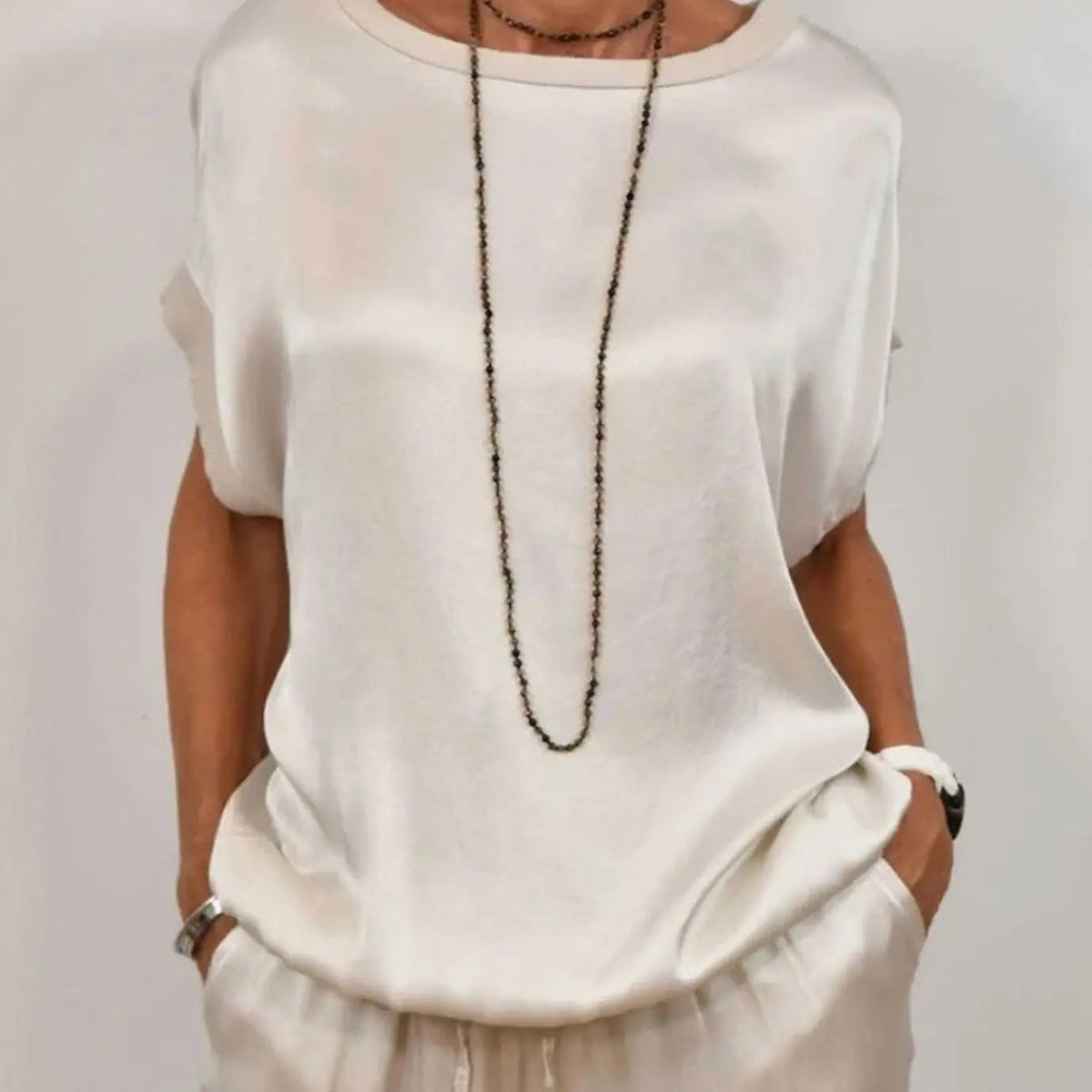 Conjunto elegante de dos piezas para mujer con pantalón de pierna ancha y top de manga corta