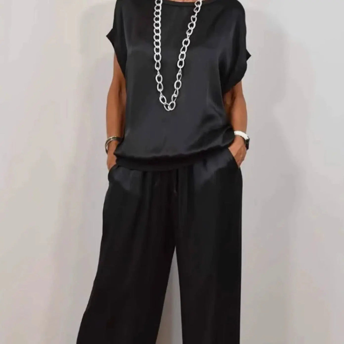 Conjunto elegante de dos piezas para mujer con pantalón de pierna ancha y top de manga corta