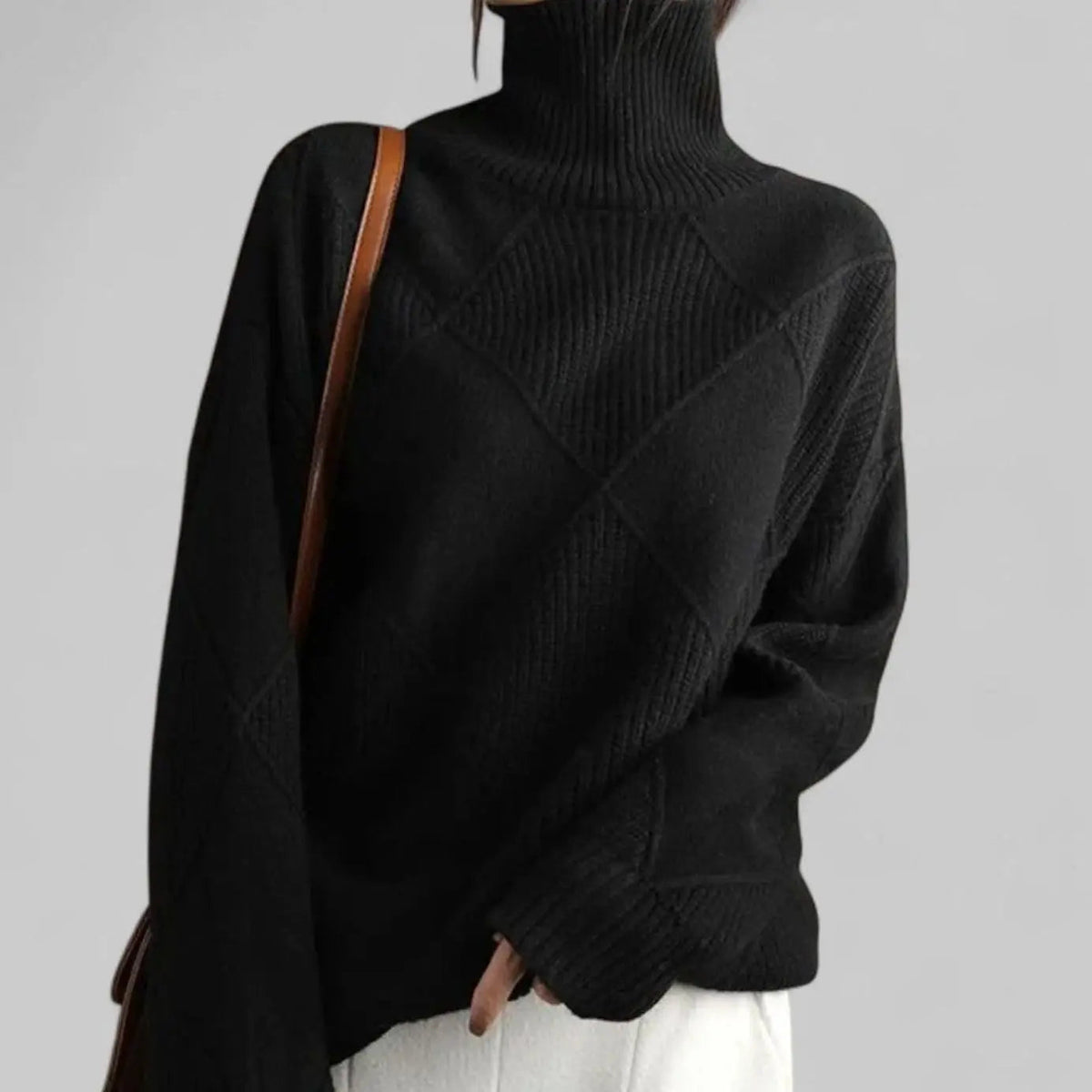 Suéter extragrande de punto de rombos con cuello alto para mujer