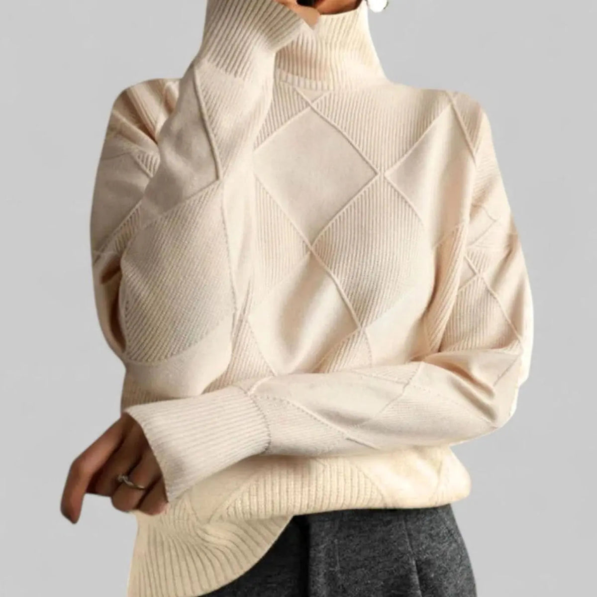 Suéter extragrande de punto de rombos con cuello alto para mujer