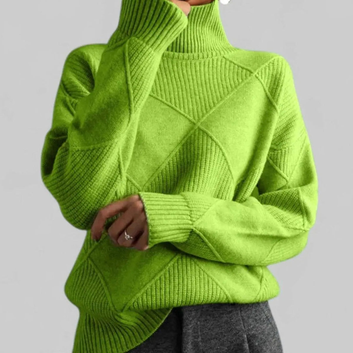 Suéter extragrande de punto de rombos con cuello alto para mujer