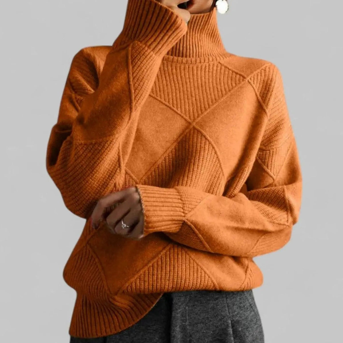 Suéter extragrande de punto de rombos con cuello alto para mujer