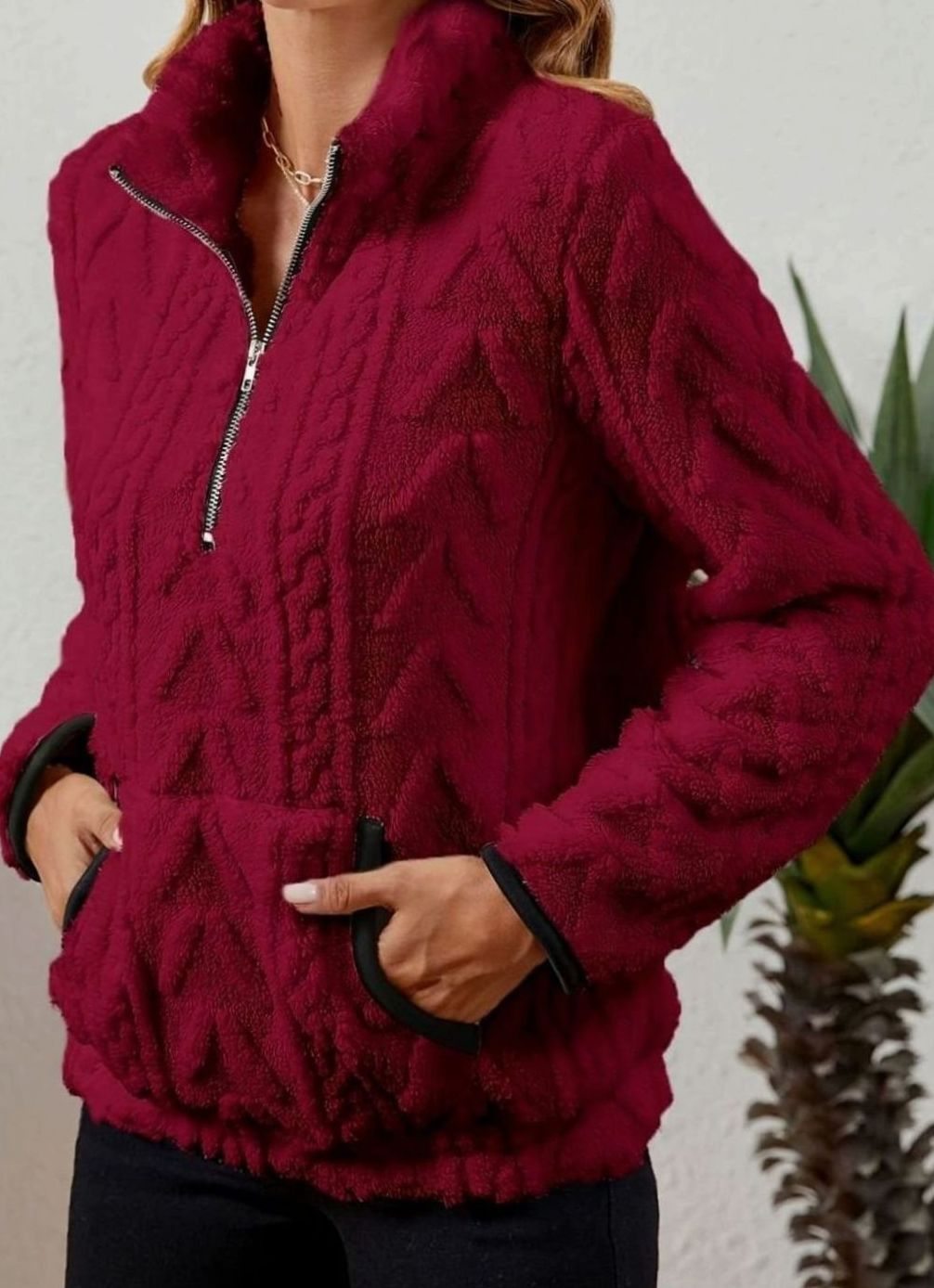 Jersey polar texturizado de manga larga con media cremallera y bolsillo tipo canguro para mujer
