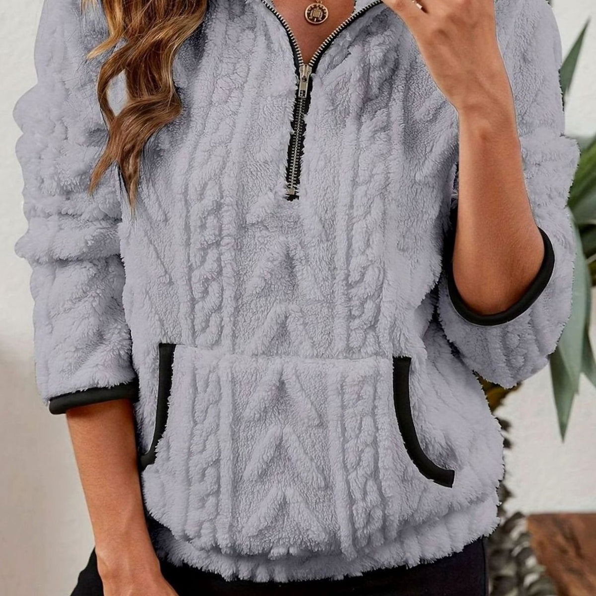 Jersey polar texturizado de manga larga con media cremallera y bolsillo tipo canguro para mujer